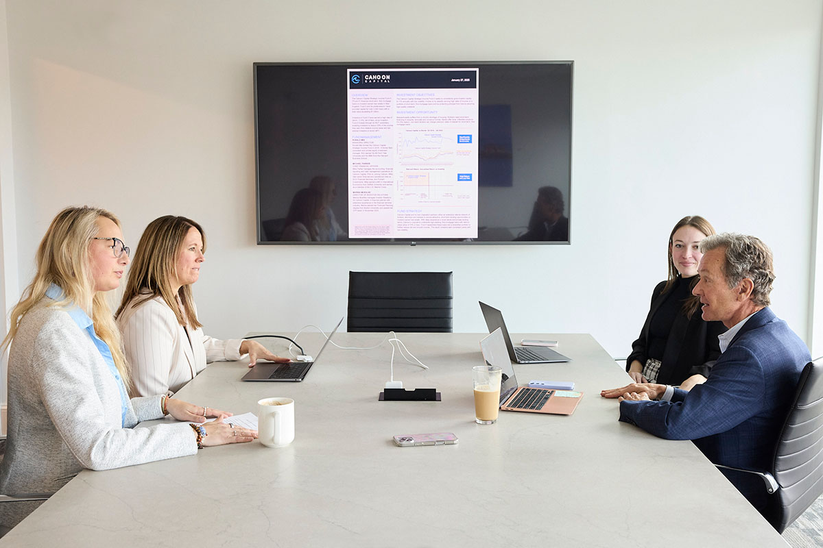 Ron, Marina, Laura and Cory meeting in the Cahoon Capital conference room